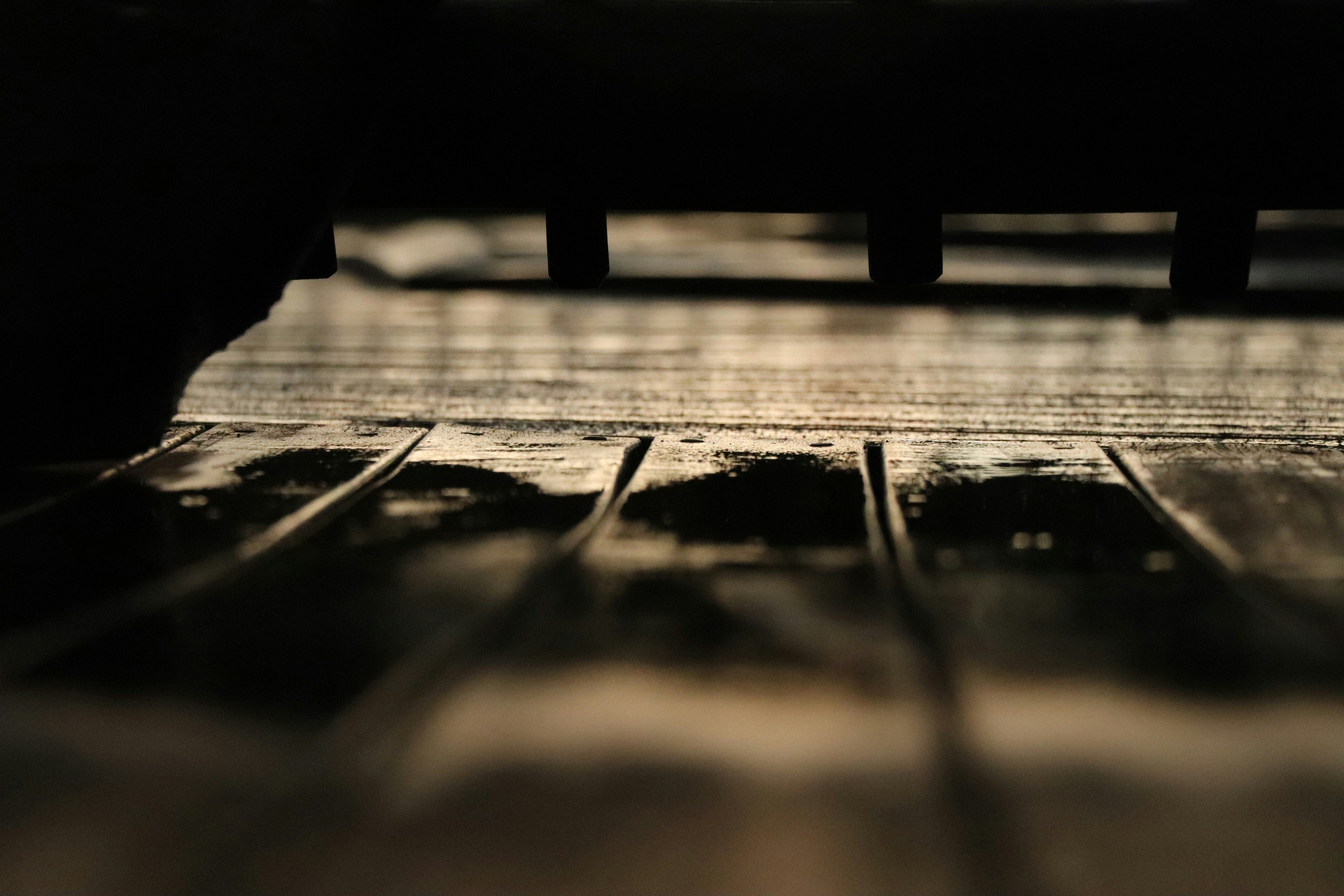 Frequently Asked Questions (FAQ) ❓ by Piano Brands a close up of a wooden floor with a blurry background