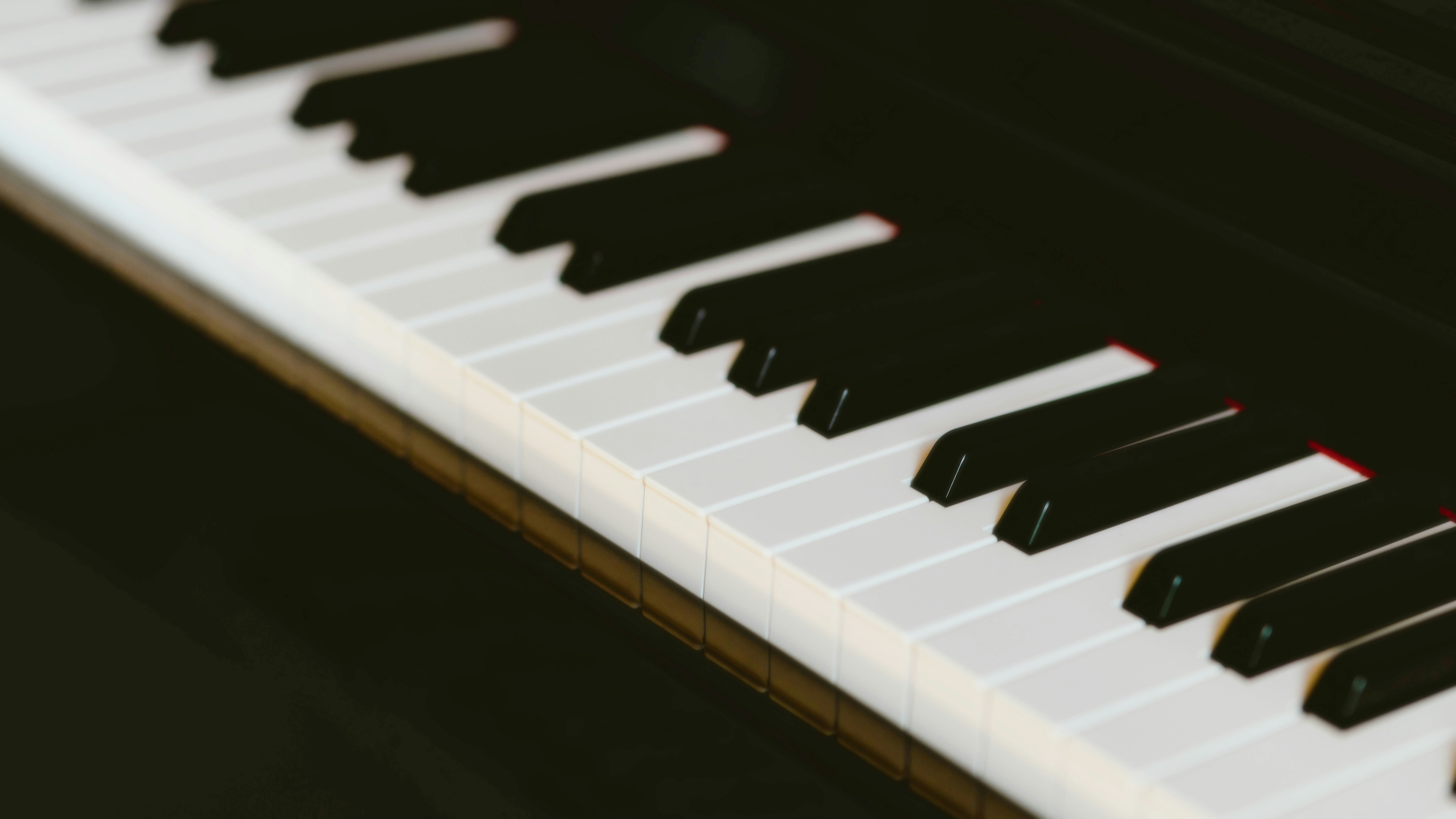 Conclusion: Striking the Right Chord 🎶 by Piano Brands A close up of a piano with black and white keys